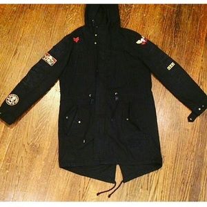 Black trench with cool patches
